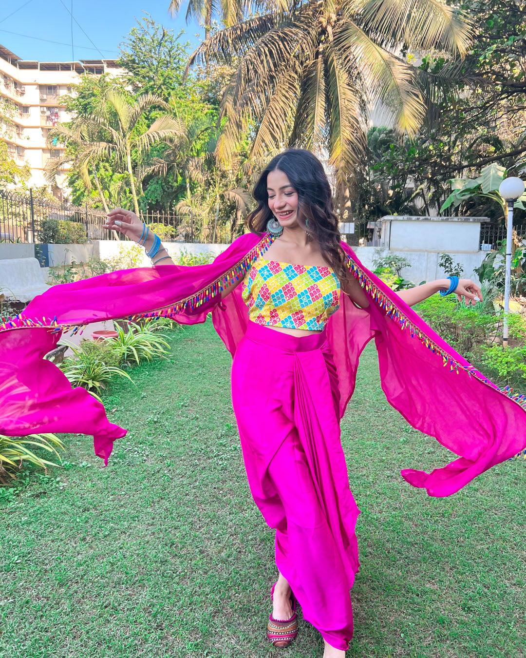 Pink 2 piece set with multicolour crop top and detailing on the shrug